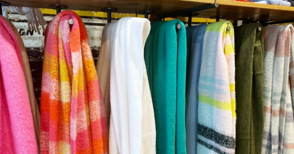 Anthropologie scarves hanging in store 
