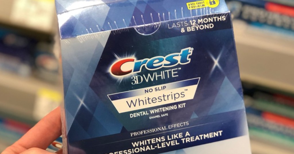 hand holding box of Crest whitestrips