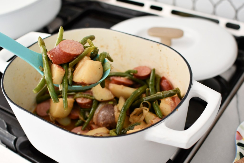 dishing up sausage green beans and potatoes