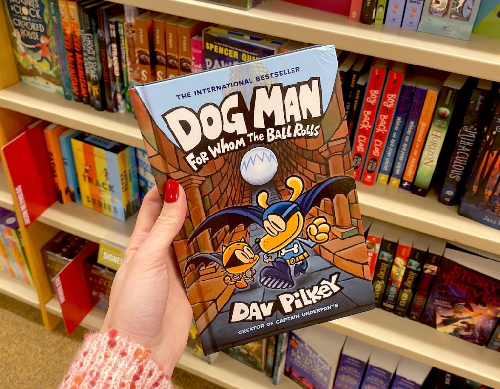 hand holding dogman book in store