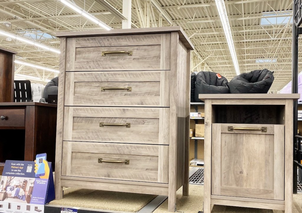 four drawer dresser and nightstand sitting on store shelf 