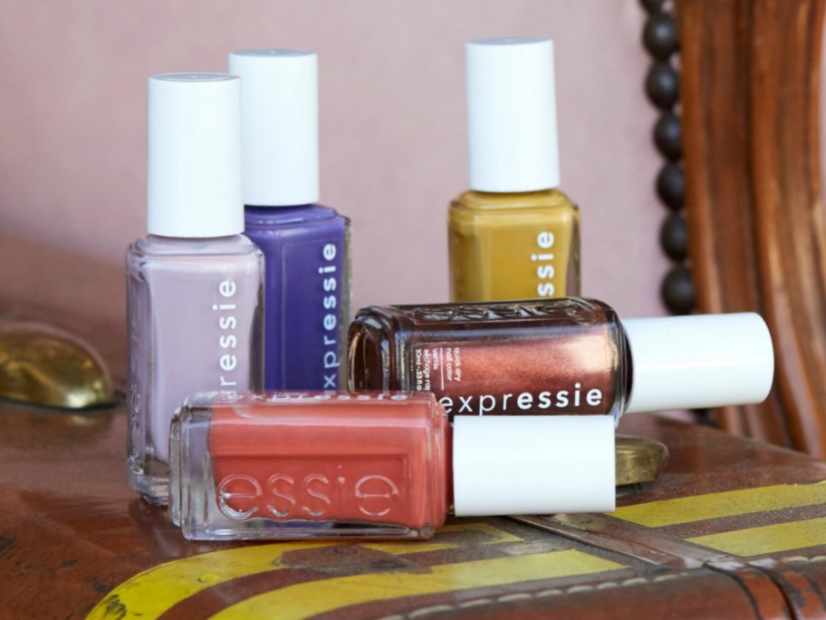 Different colored bottles of essie Expressie Nail Polishes