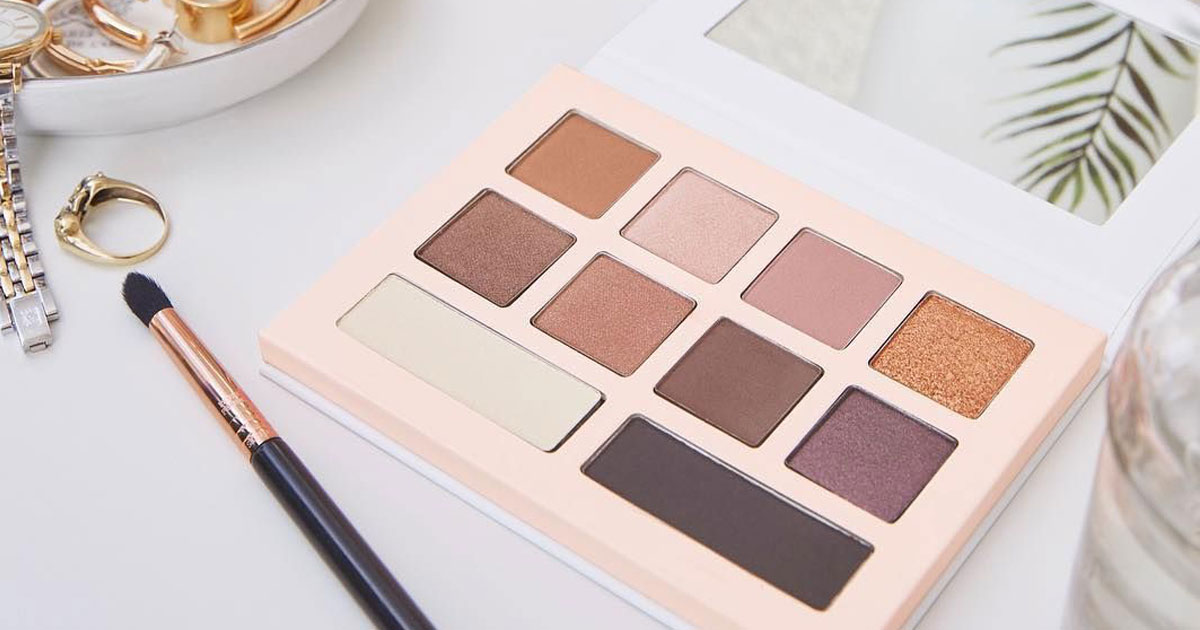 Honest Beauty Eyeshadow Palette with 10 Pigment-Rich Shades on a desk with accessories