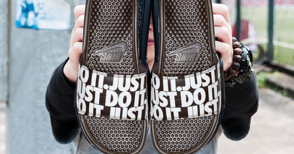Nike Men's Benassi JDI Print Slide Sandals from Finish Line boy holding a pair