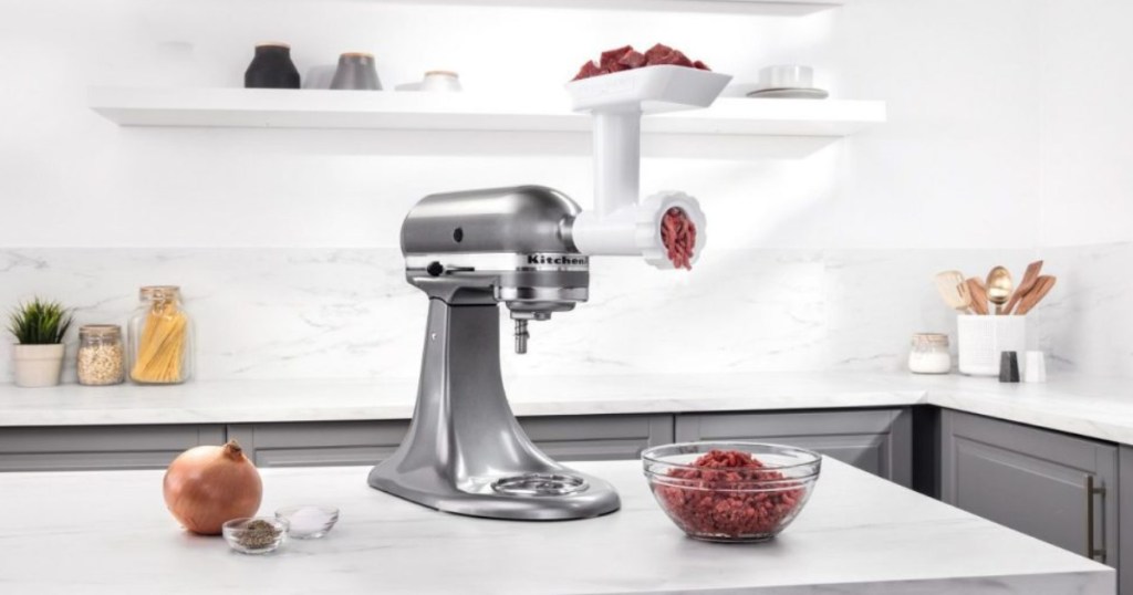 silver kitchenaid on counter grinding meat