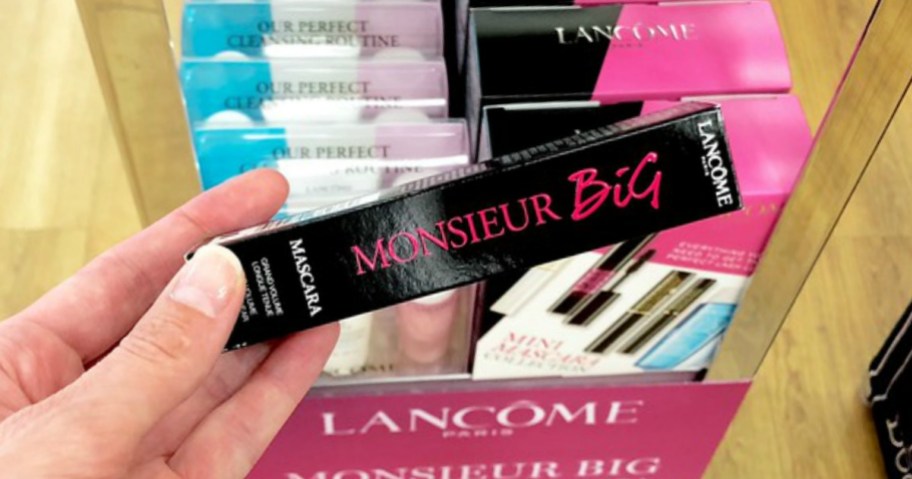 hand holding lancome mascara in the store