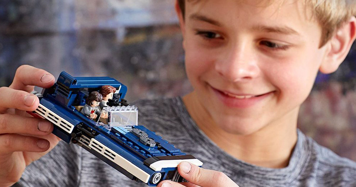 boy playing with lego han solo landspeeder