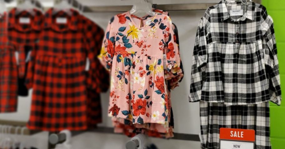 girls dresses in flowers and plaid hanging in old navy store