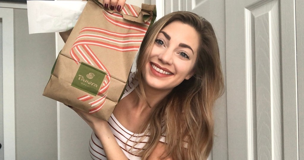 woman smiling holding panera bag