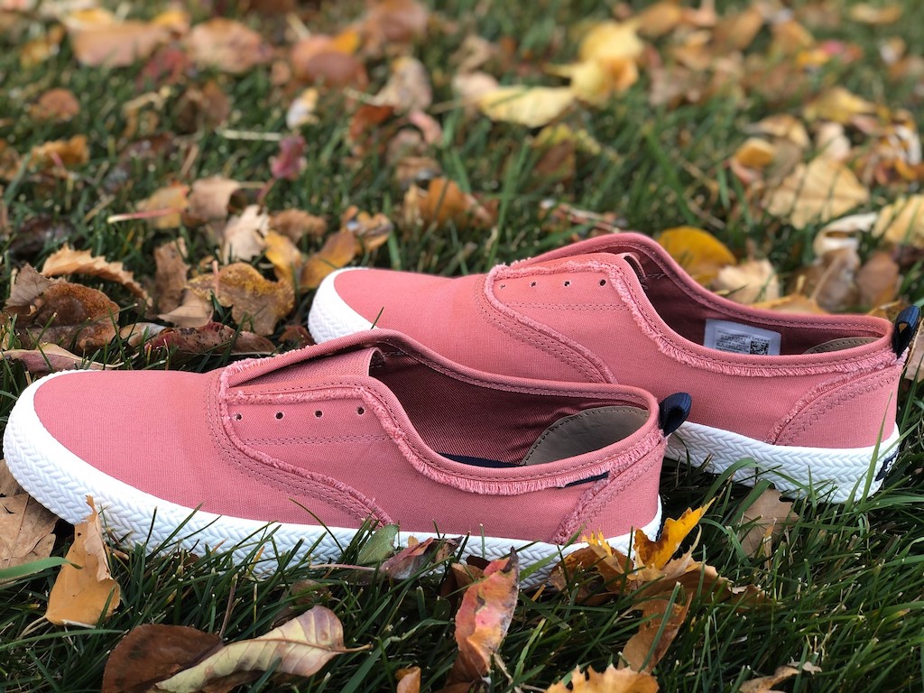 pink Sperry shoes sitting in the grass