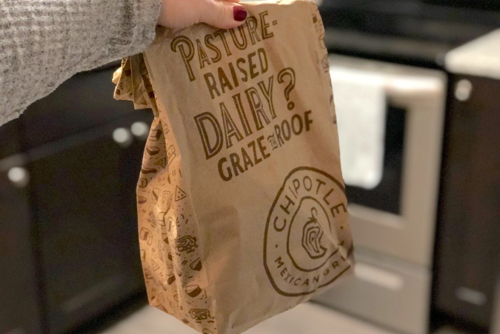 hand holding brown chipotle bag