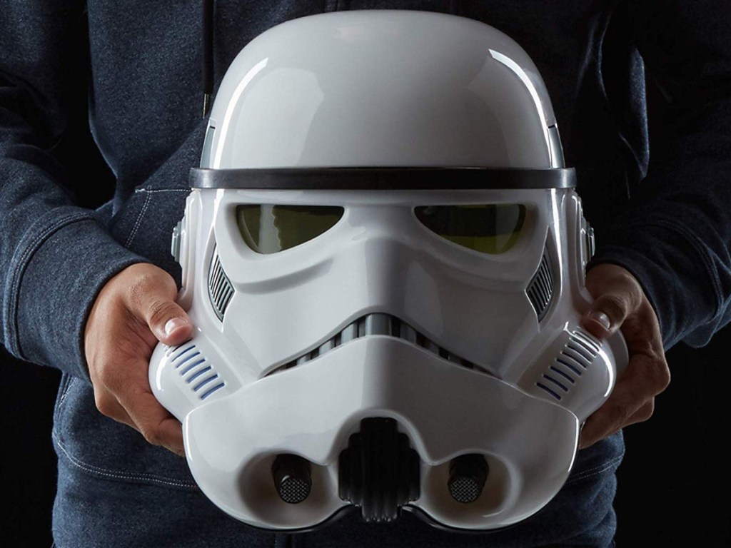man holding storm trooper mask