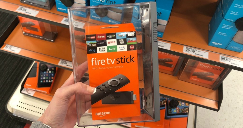 hand holding tv stick in a store