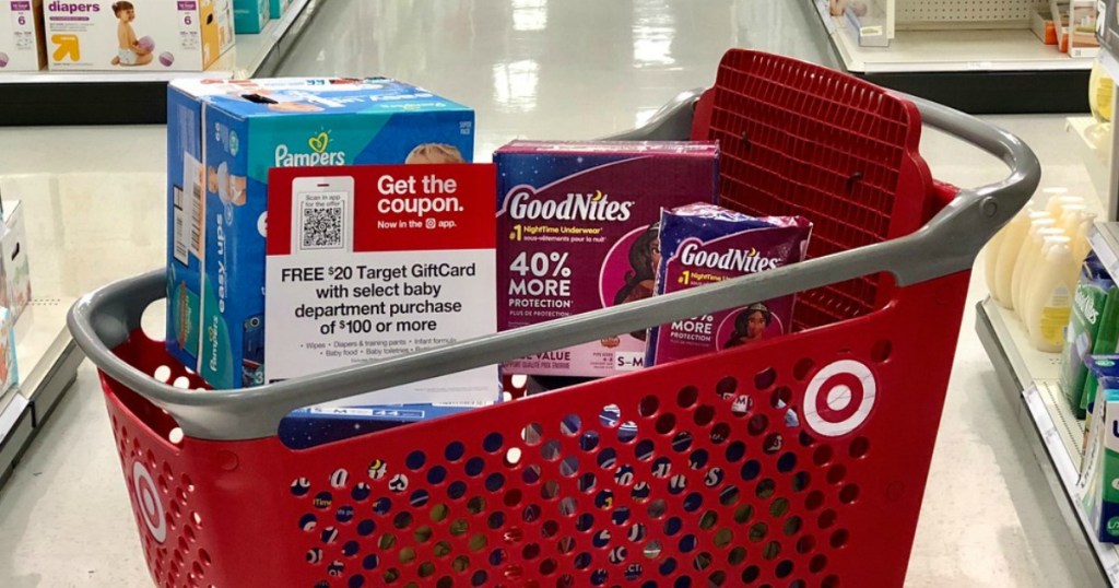 shopping cart full of diapers in a store