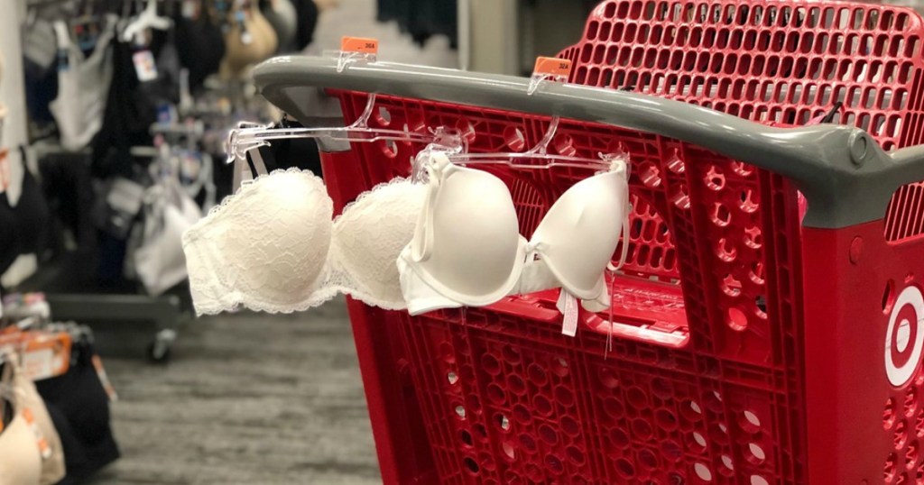 bras hanging on shopping cart in a store