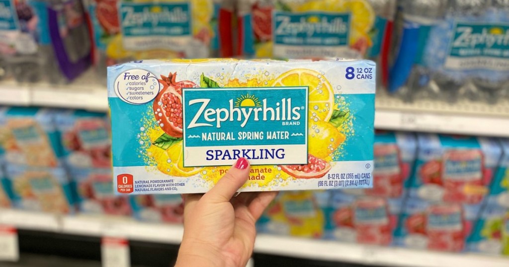 hand holding sparkling water multipack in a store