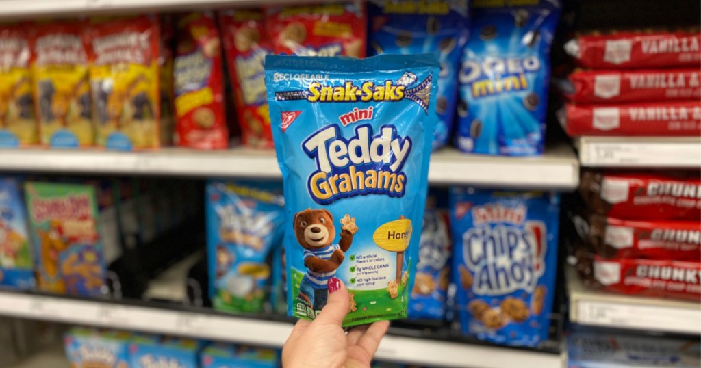 hand holding up bag of mini teddy grahams at target
