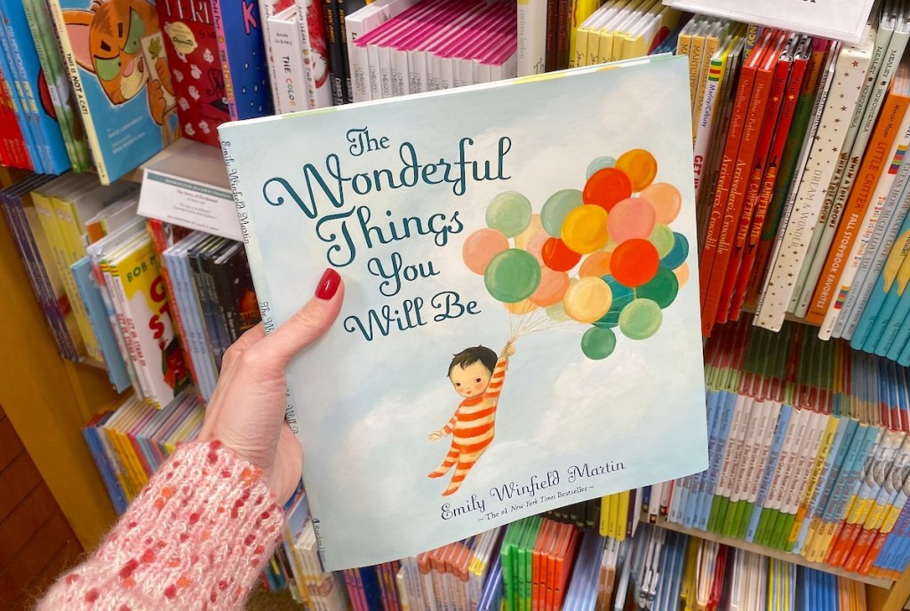 hand holding the wonderful things you will be book 