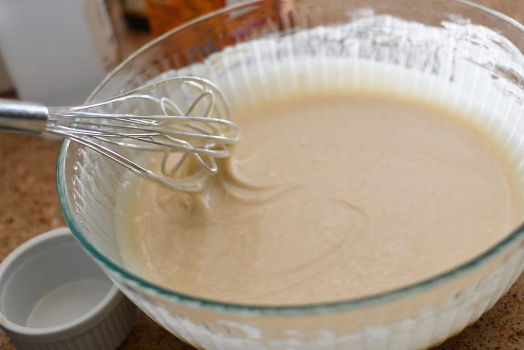 mixing thin batter for vanilla crazy cake