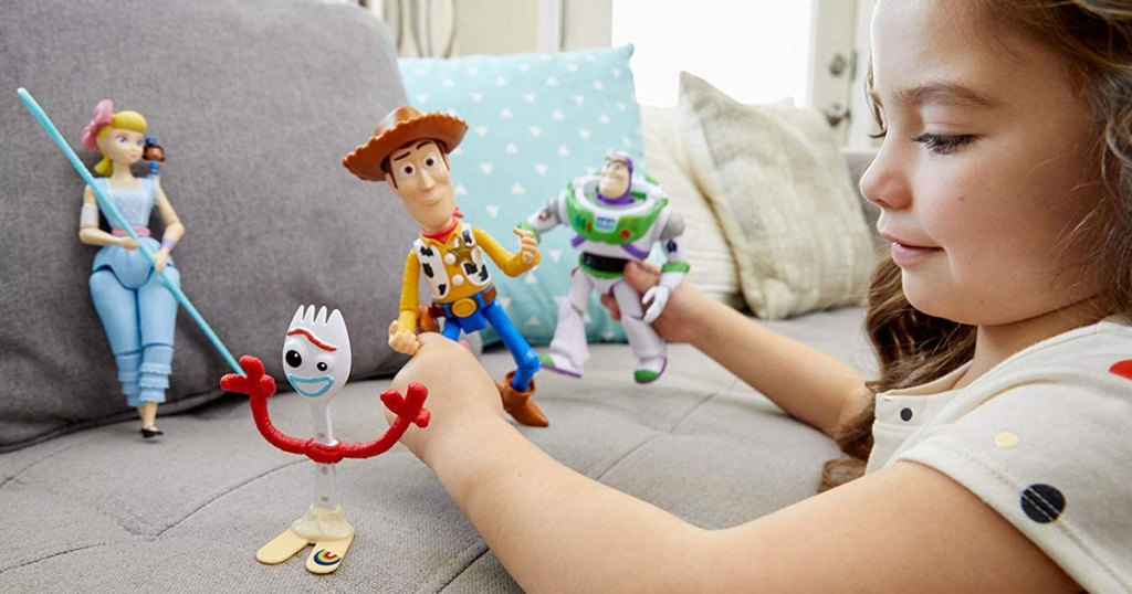 little girl playing with Disney Pixar Toy Story Adventure Pack