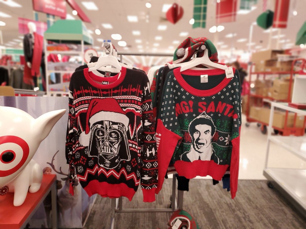 womens ugly christmas sweaters hanging in store