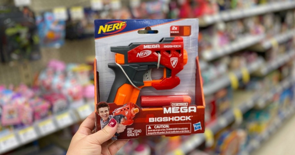 hand holding toy gun in a store
