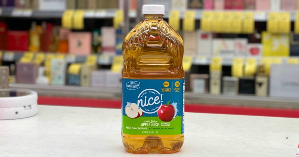 bottle of apple juice on a counter in a store