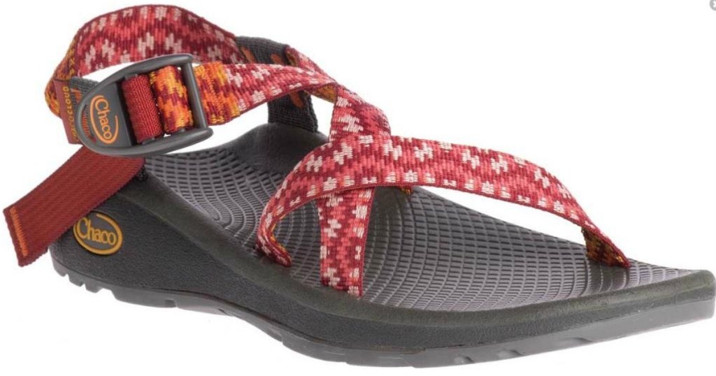 sandal with red straps on it