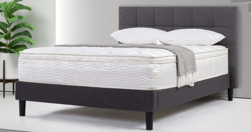 mattress on grey frame with grey headboard 