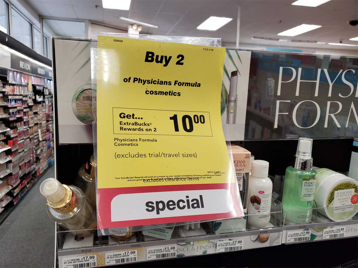 sign in a store showing a promotion with physicians formula products on a shelf