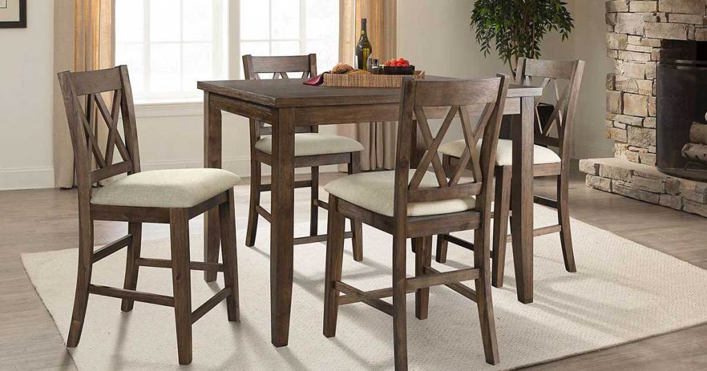 Oliver 5-Piece Counter-Height Dining Set in a dining room with a rug and fireplace
