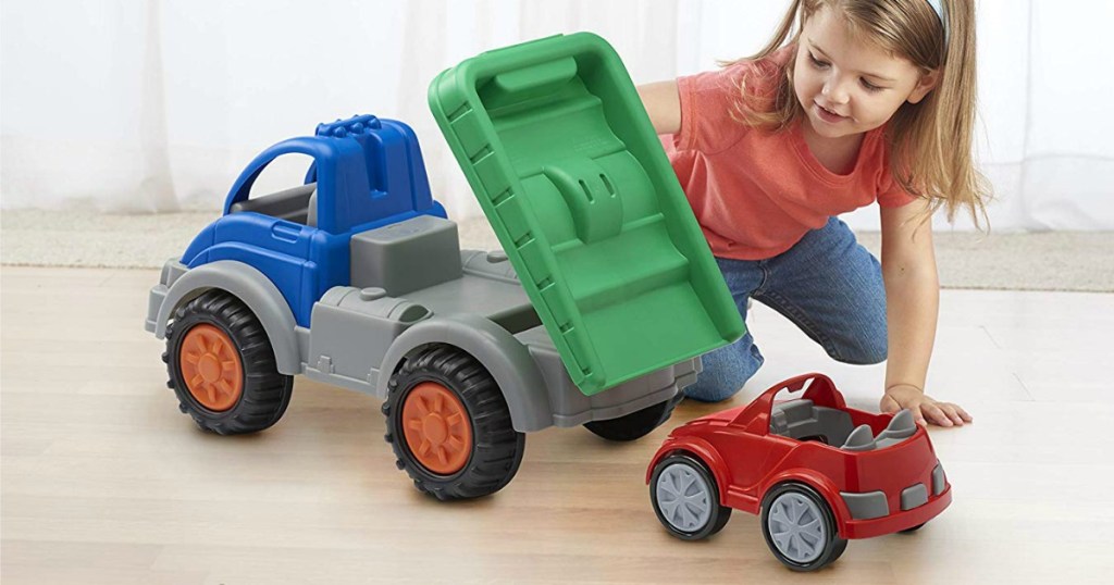 girl playing with American Toys Gigantic Tow Truck with Car