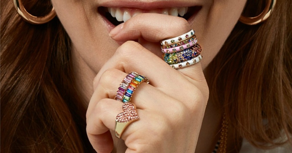 woman wearing multiple gemstone rings