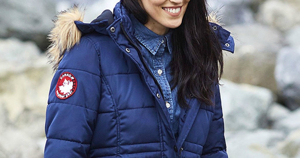 Woman wearing a Navy blue Canada Weather Gear Puffer Jacket