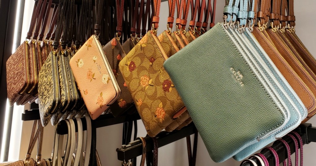 Different colored Coach Wristlets in store