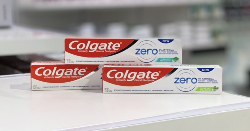 three packs of Colgate Zero Toothpaste on white counter