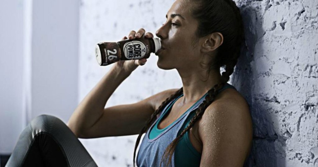 woman drinking Core Power High Protein Shakes after workout