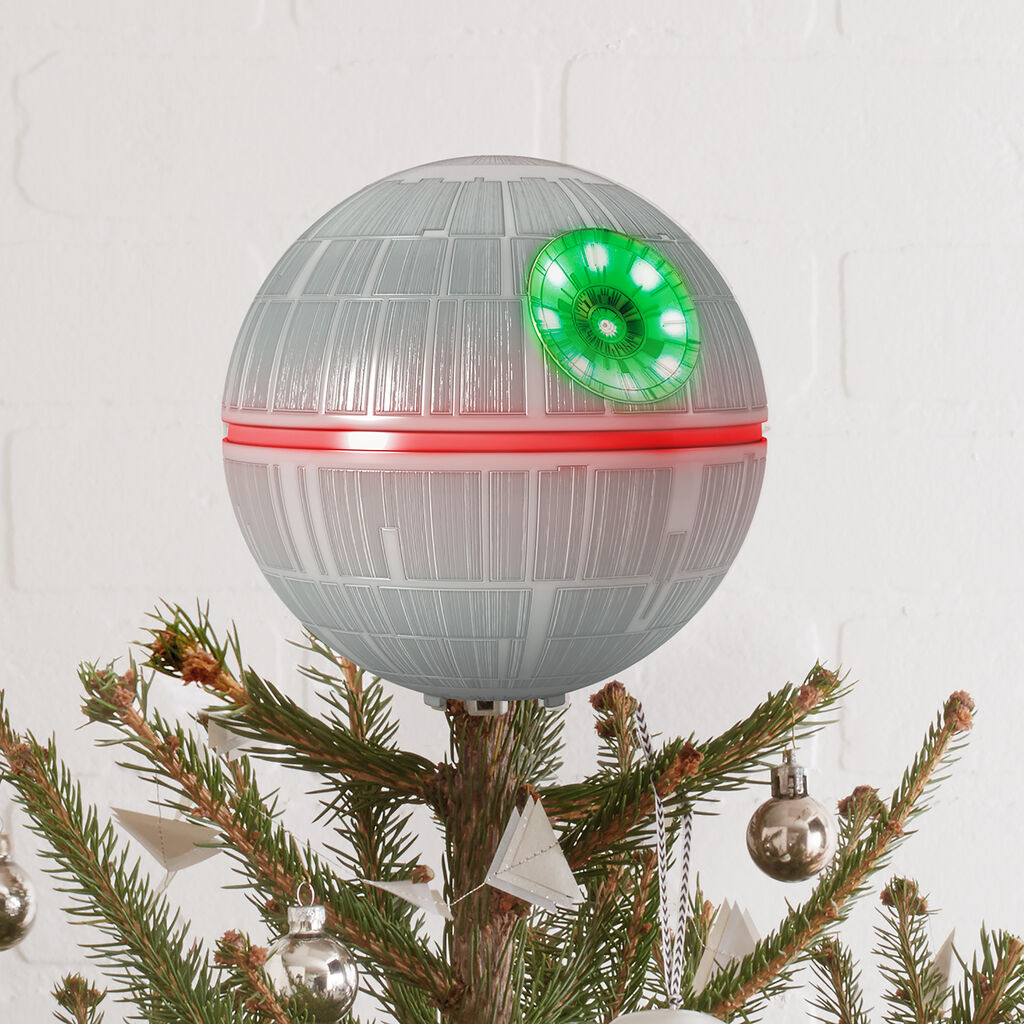 Death Star Tree Topper on top of tree
