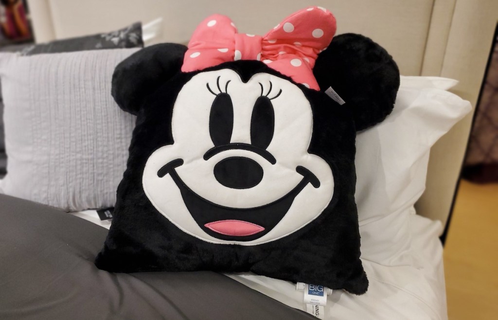 Disney The Big One Minnie Mouse Pillow sitting on bed