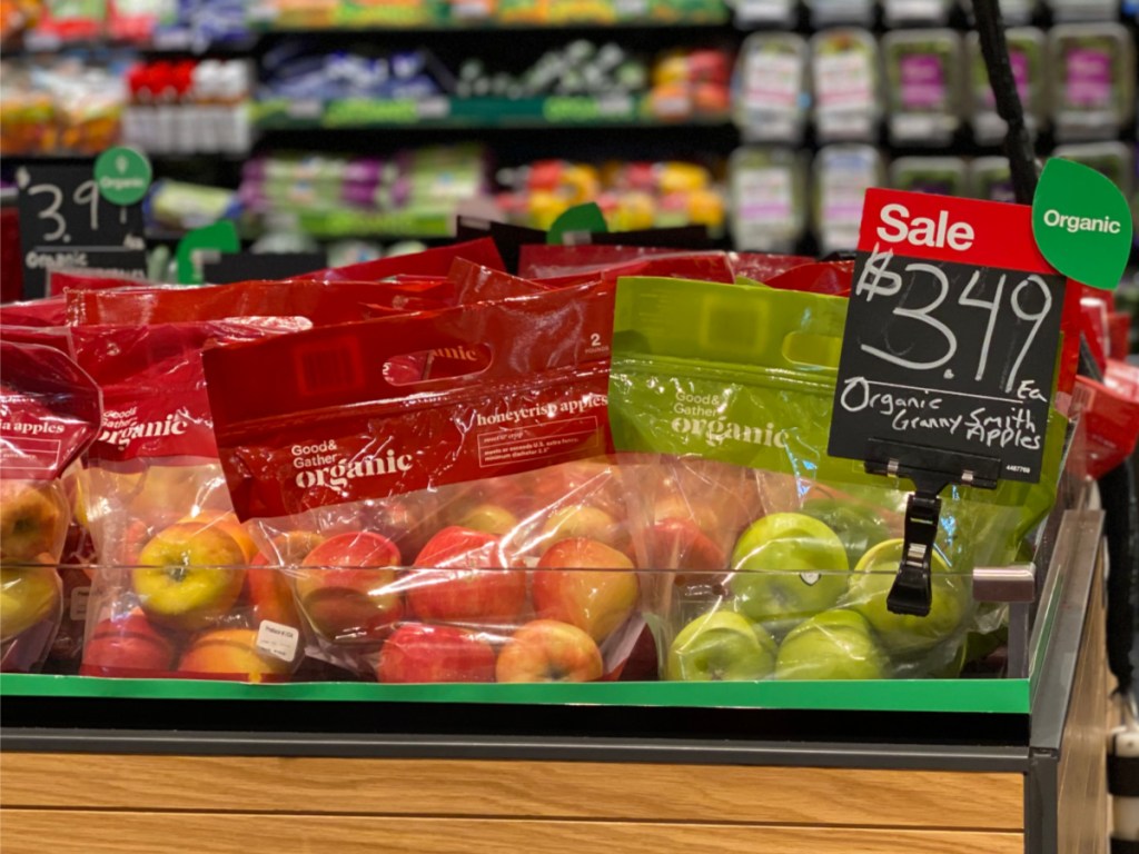 organic apples display with price sign in-store