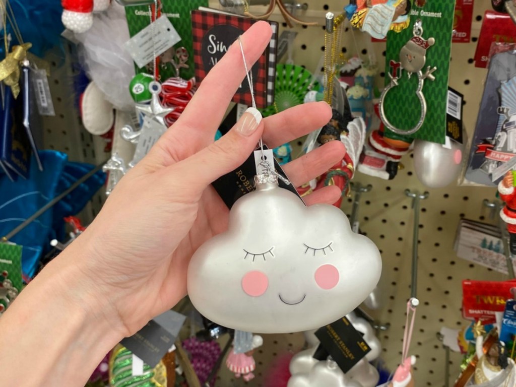 cloud themed glass ornament in hand at Hobby Lobby