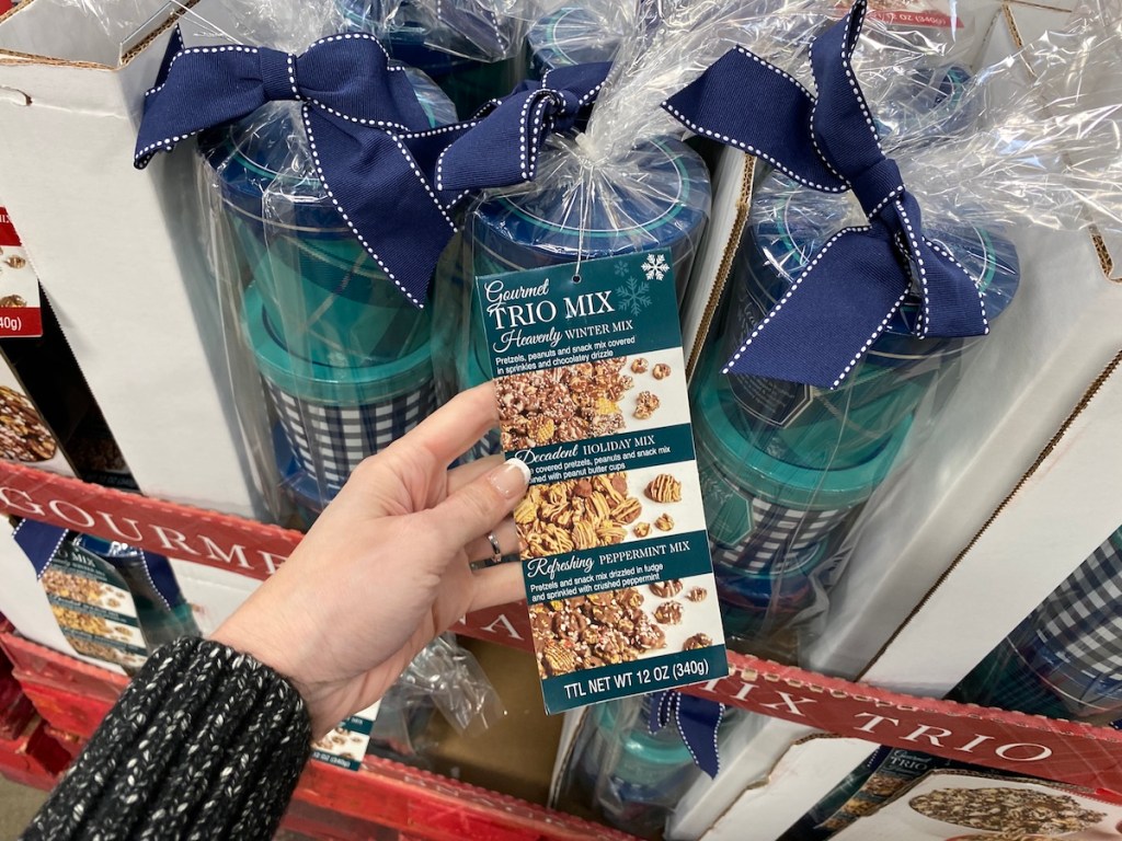 hand holding tag on the Holiday Snack Mix Trio at Sam's Club