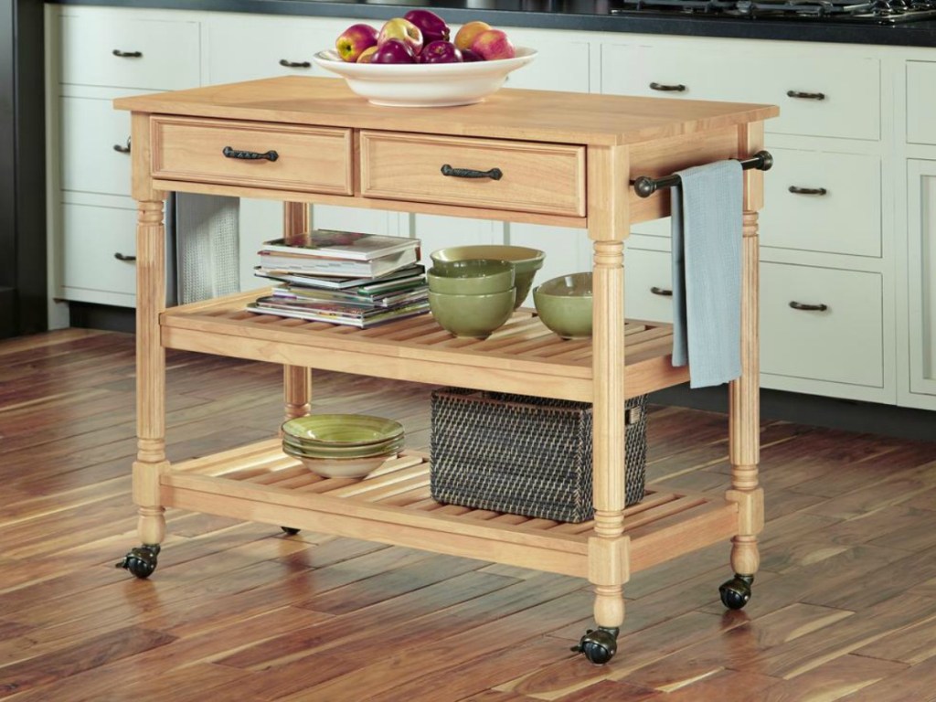 Maple finished kitchen storage cart with plates on shelving