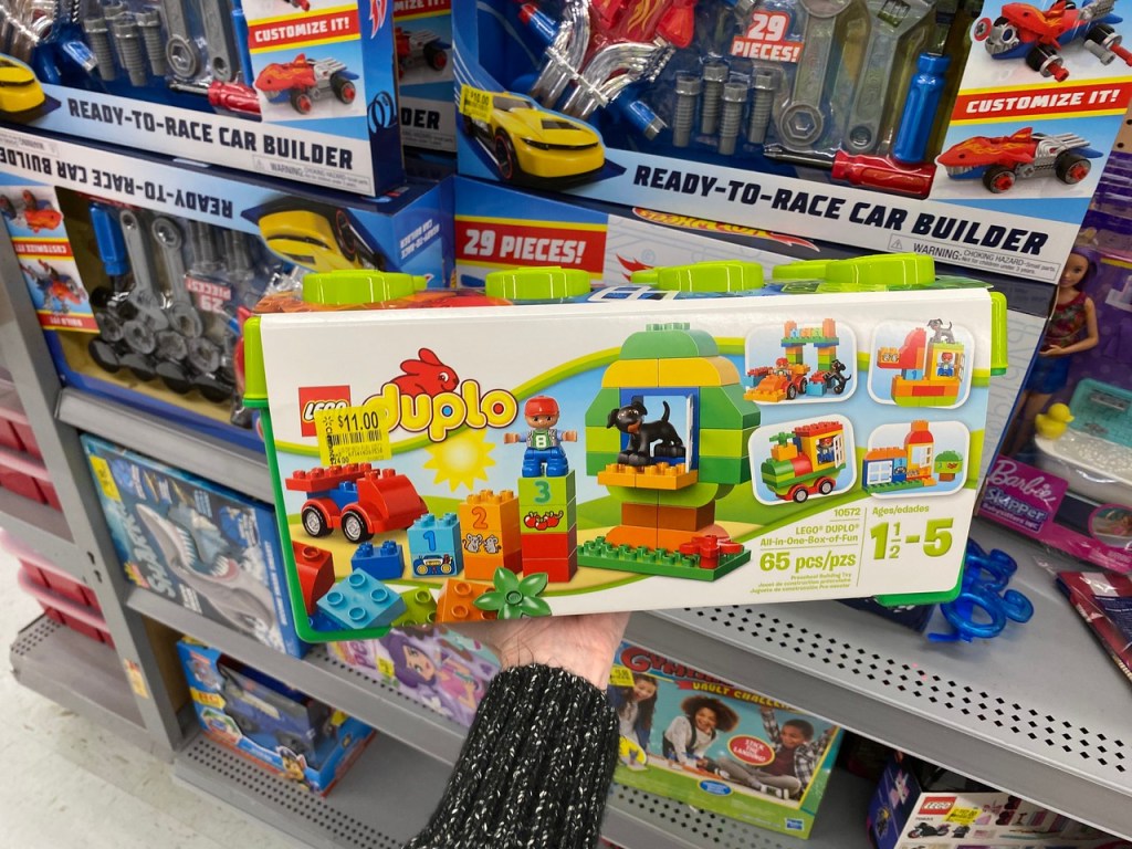 Woman's Hand Holding up LEGO Duple All-in-One
