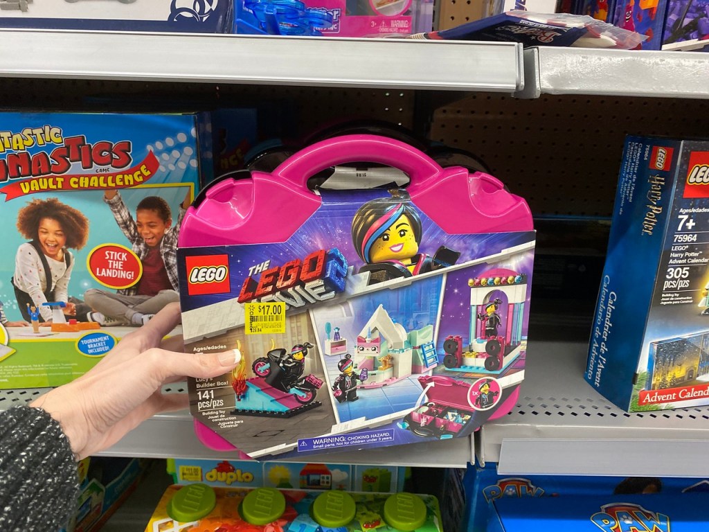 Hand holding Lego Movie Case with clearance tag