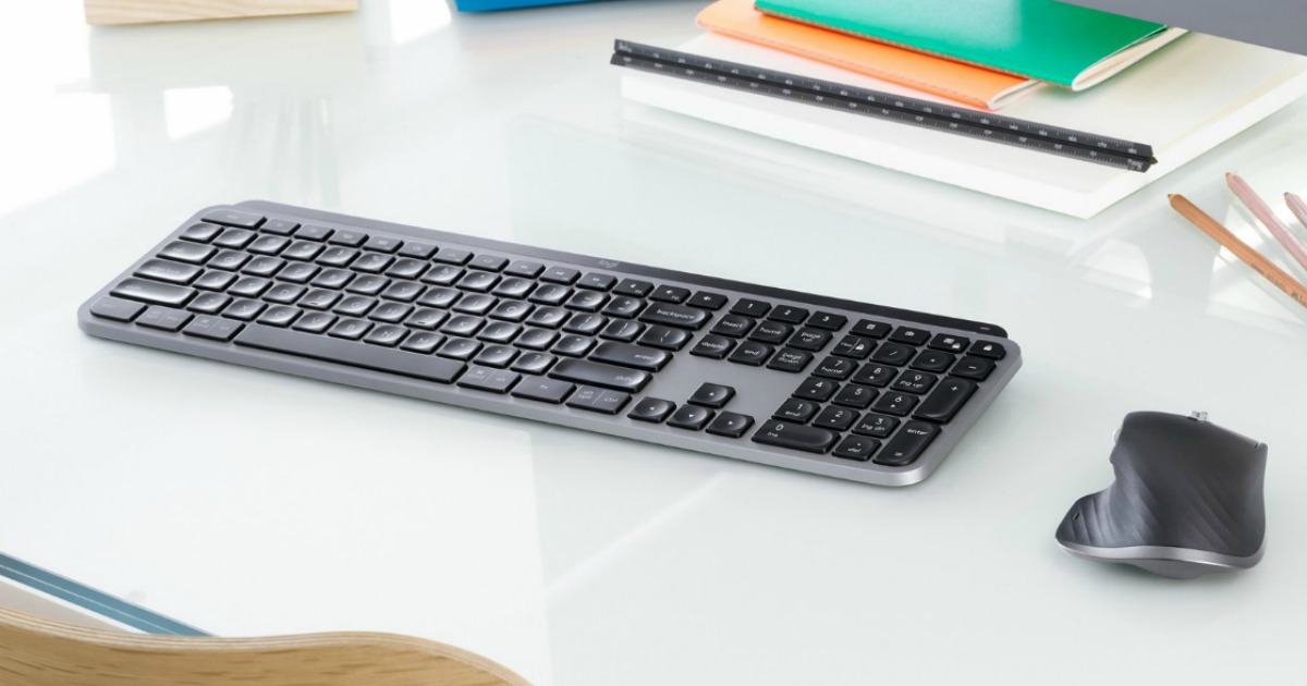 Logitech MX brand keyboard and mouse on white reflective desktop