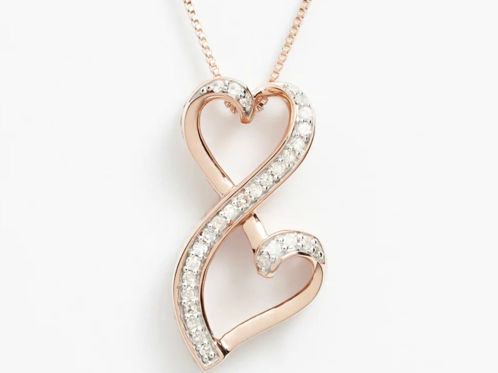 Double heart necklace with rose gold over silver and diamond detailing