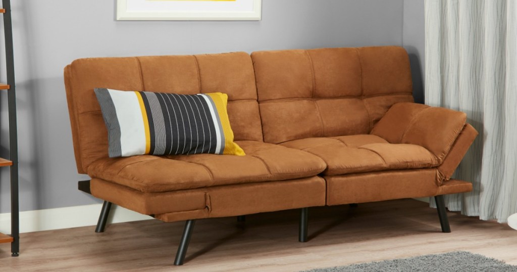 futon with pillow on it