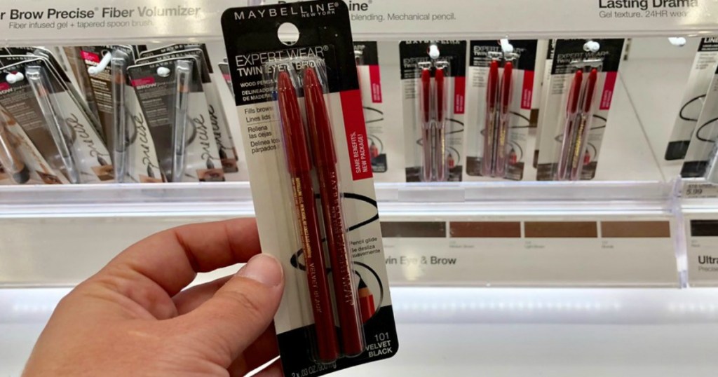 Maybelline eye brow pencils being held by a woman