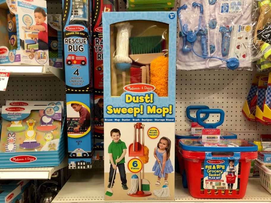 Melissa & Doug Dust Sweep Mop Set in a package on display at a store